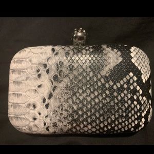 Small white and black clutch with skull opener